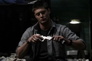 Dean cleaning his guns. Fnar.